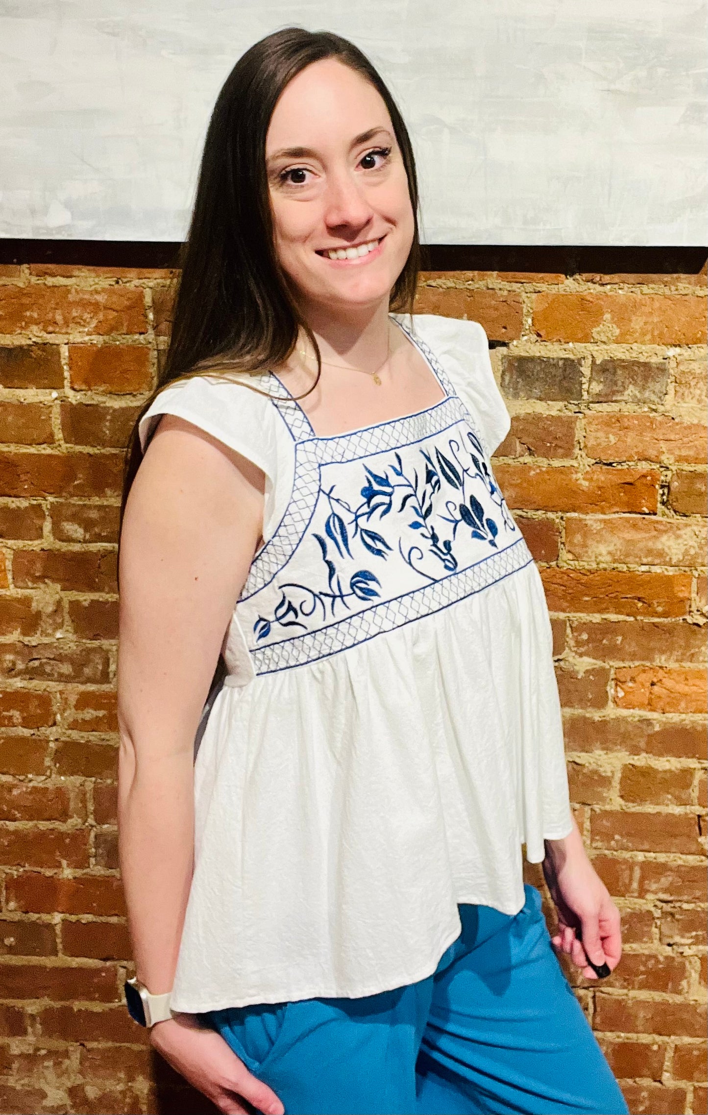 White Ruffle Sleeve Flowy Top with Blue Embroidered Detailing at Bust