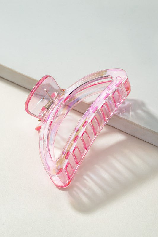 Pink hair clip on a white background