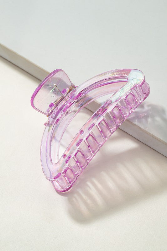 Pink hair clip on a light background