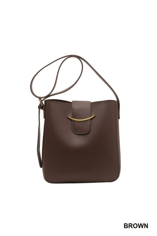 Brown shoulder bag with a gold clasp on a white background
