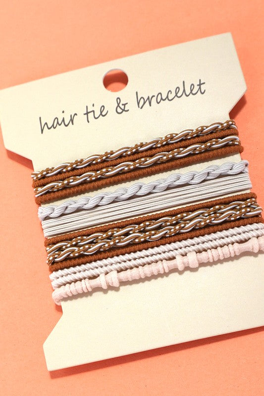 Set of hair ties and bracelets on a pink background with a label.