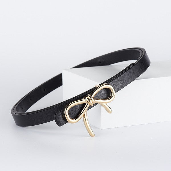 Black belt with a gold bow buckle on a white background