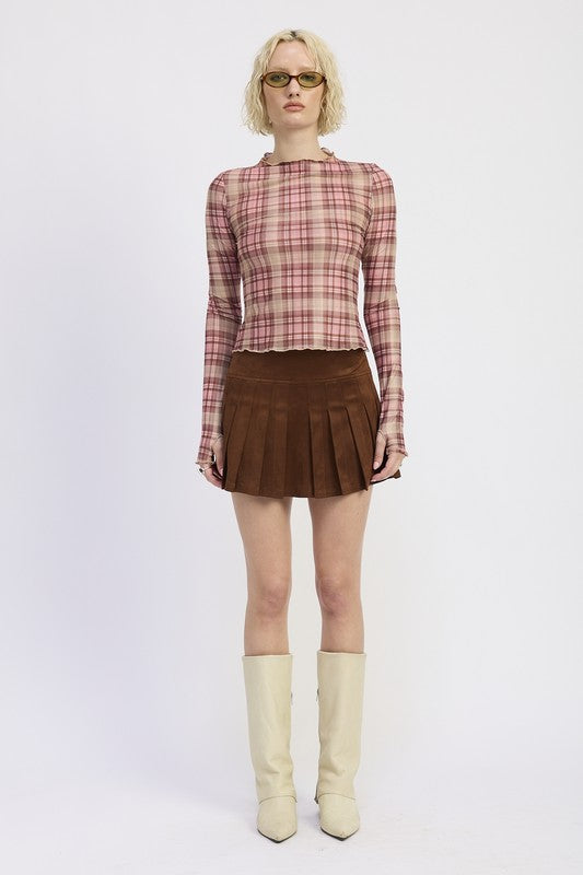 Woman wearing a plaid shirt and brown skirt with a yellow bag on a white background