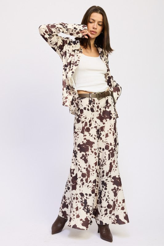 Woman wearing a floral outfit with a white background