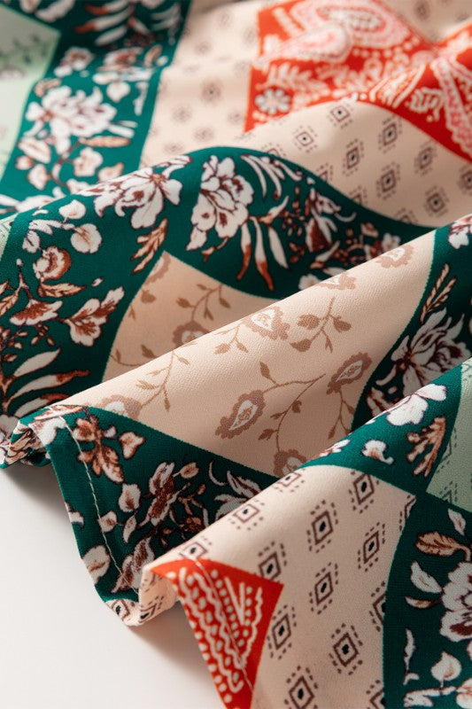 Close-up of patterned fabric with floral, geometric, and abstract designs.
