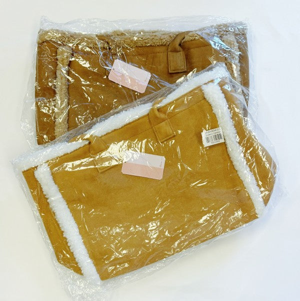 Two pairs of brown bags with white lining, still in packaging, on a white background.