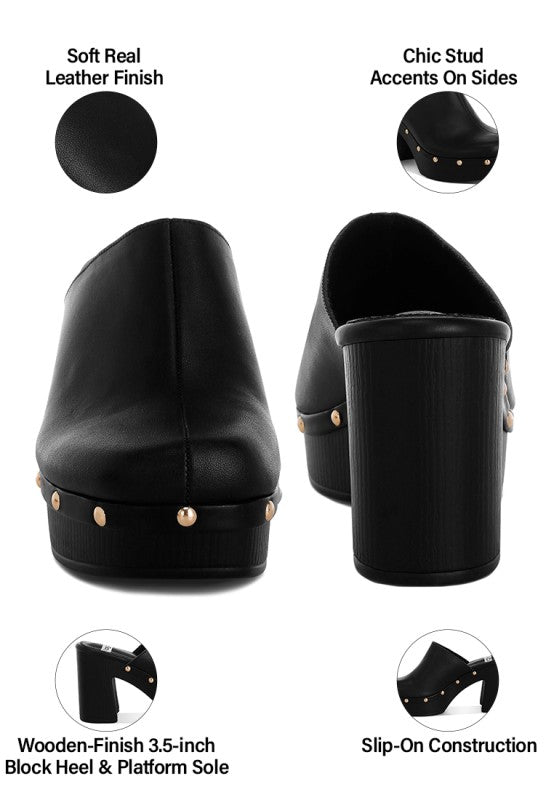 Black leather mules with wooden finish heel and platform sole, featuring stud accents on sides.