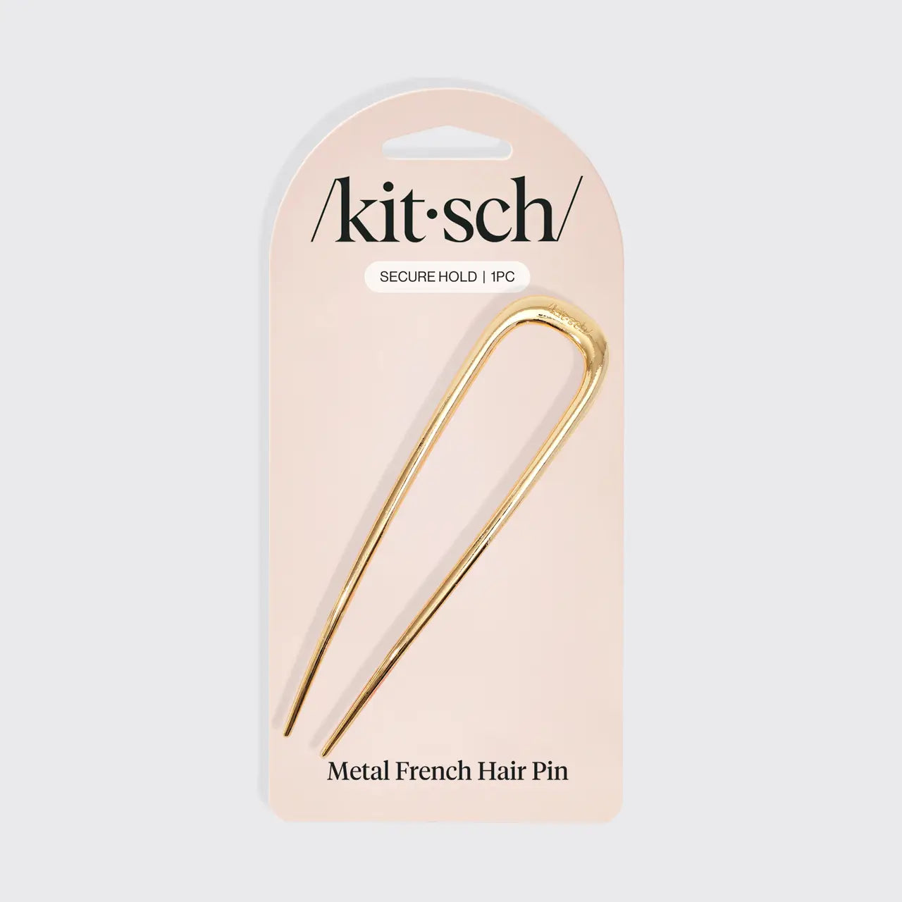 Metal French hair pin on a 'kitsch' branded card with a beige background