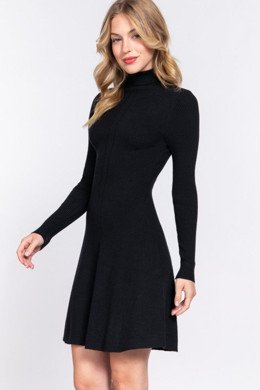 Woman wearing a black dress with long sleeves on a white background
