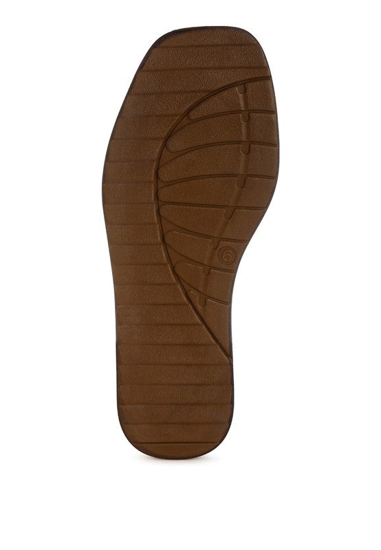 Brown sole of a shoe on a white background