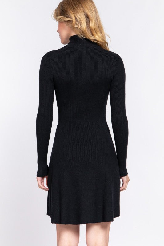 Black dress worn by a person on a white background