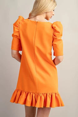 Orange mini dress with puff sleeves, straight-cut neckline, and darted bodice