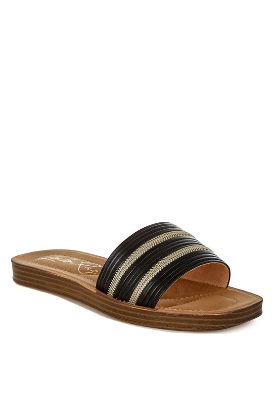Black and brown sandal on a white background