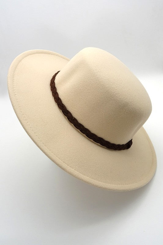 Beige fedora hat with a brown band on a white background