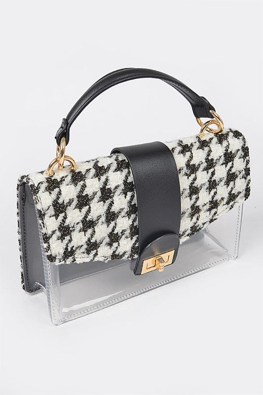 Handbag with houndstooth pattern and black accents on a white background
