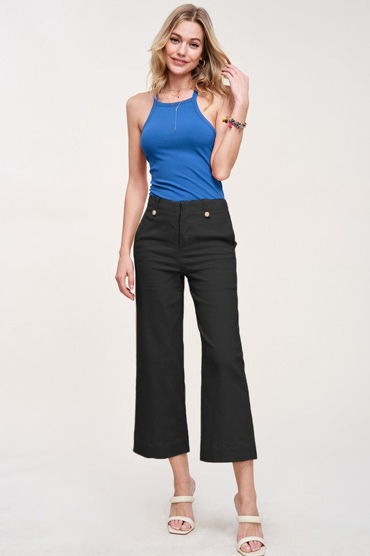 Black Soft Wash Rolla Pants with Stretchy Fabric, High Rise Fit, Button Closure at Front, Wide Leg that Hits Above the Ankle.