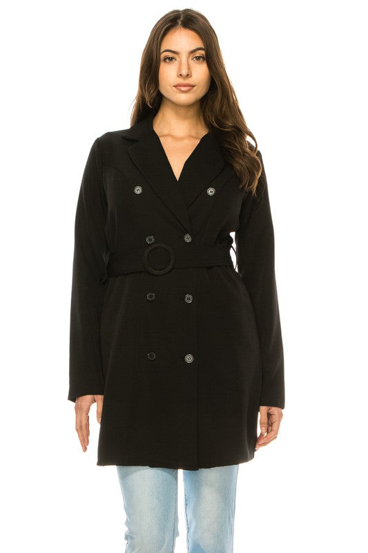 Woman wearing a black coat on a white background