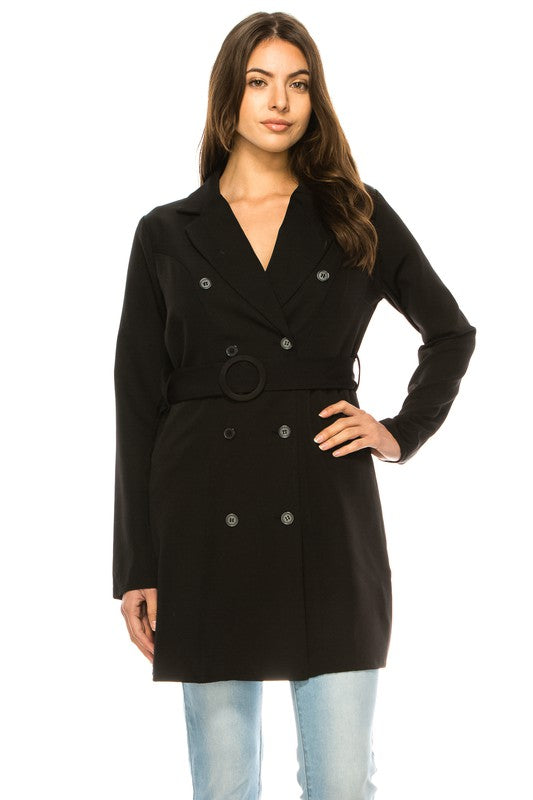 Woman wearing a black coat on a white background