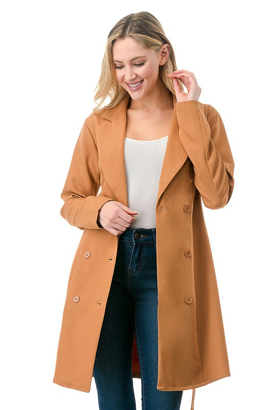 Woman wearing a brown coat on a white background