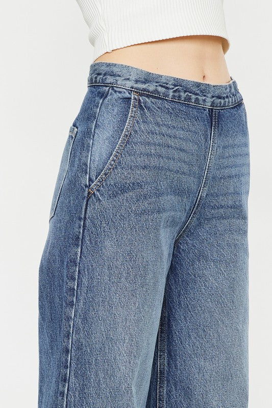 Ultra High Rise Wide Leg Medium Stone Wash Jeans Rigid with Side Zipper Closure and Front Slant Pockets. Back Darts, Back Patch Pockets.