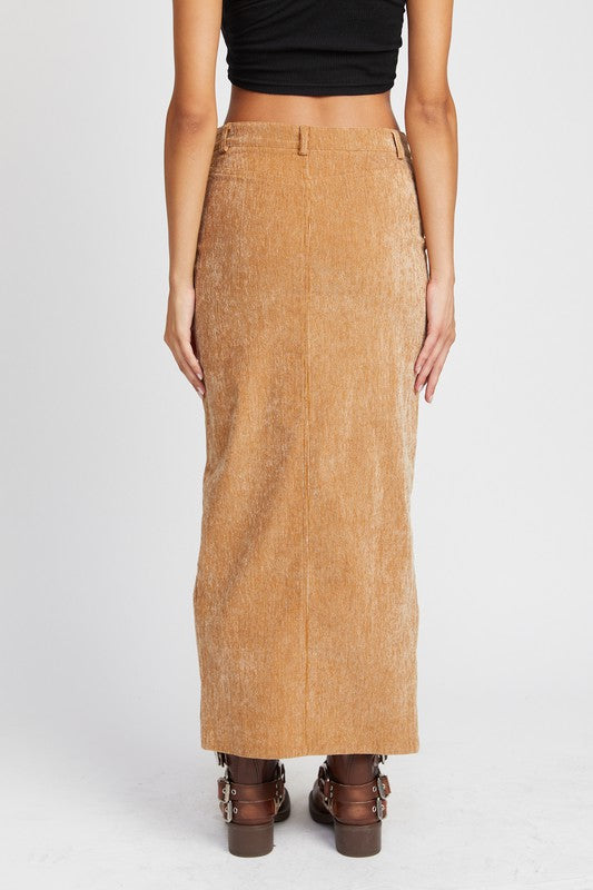 Person wearing a tan corduroy skirt on a white background