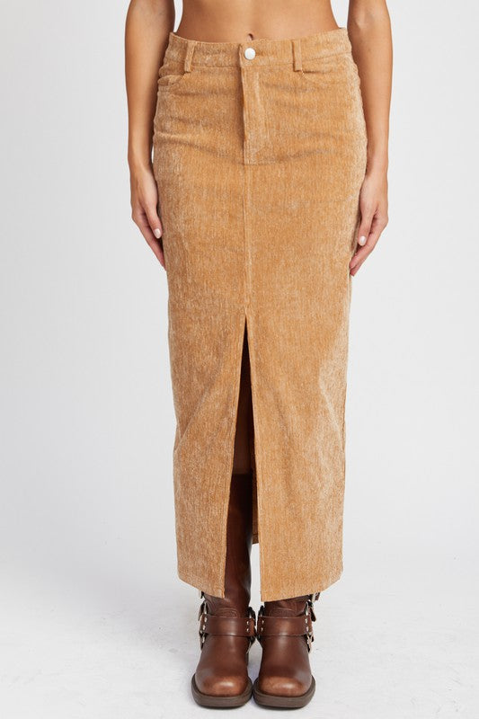 Brown corduroy skirt worn by a person on a white background