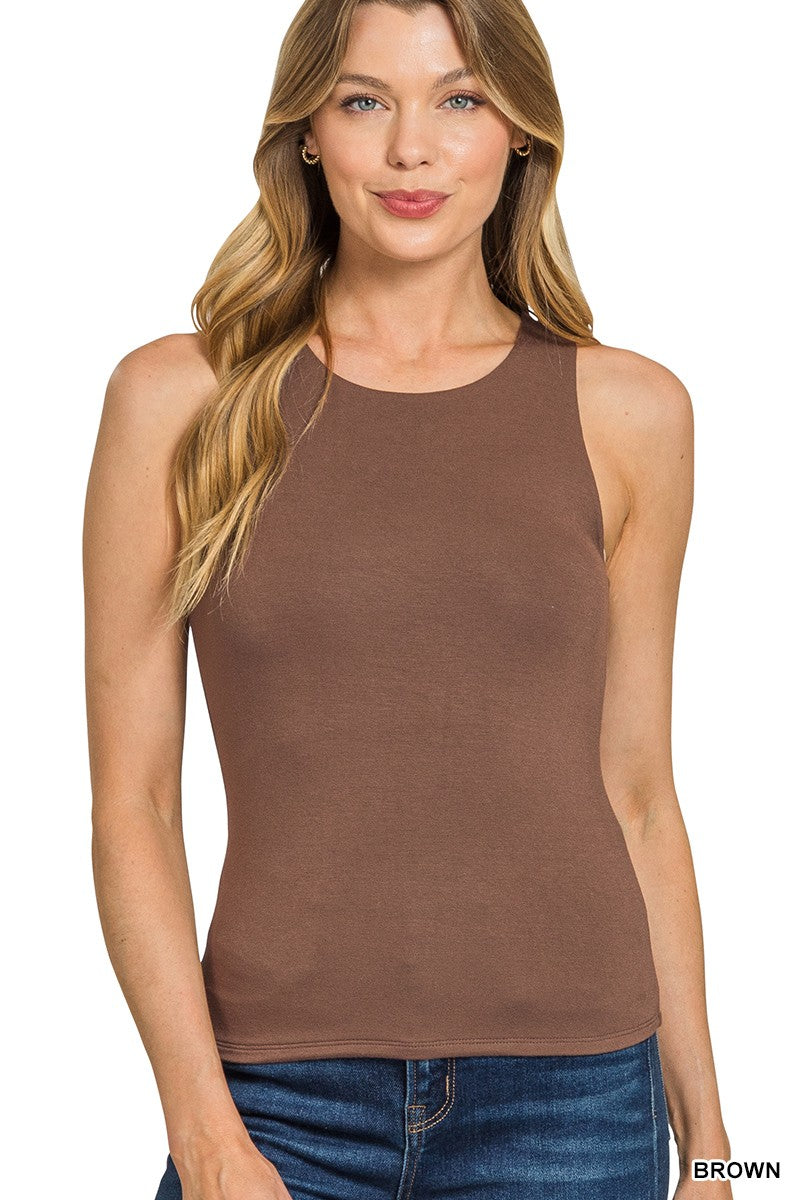 Woman wearing a brown tank top on a white background