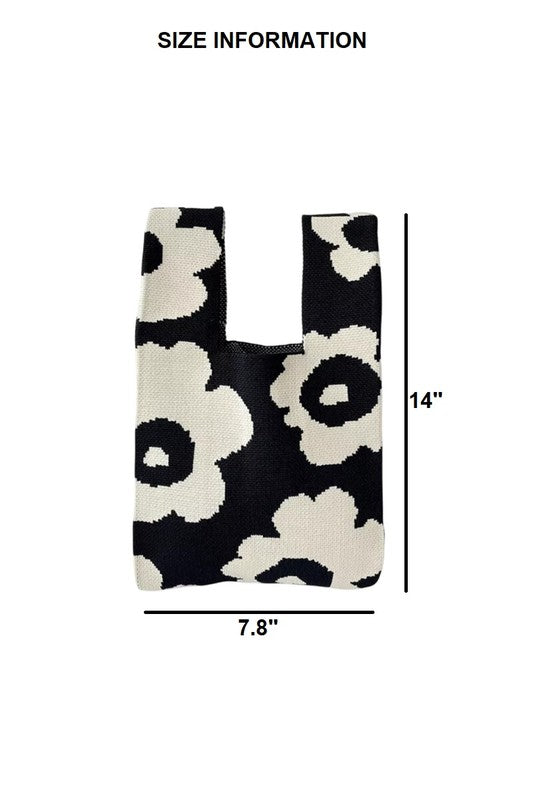 Black and white floral patterned reusable bag with size measurement on a white background