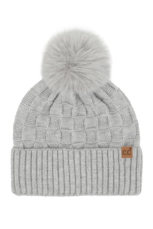 Gray knit beanie with pom-pom on a white background