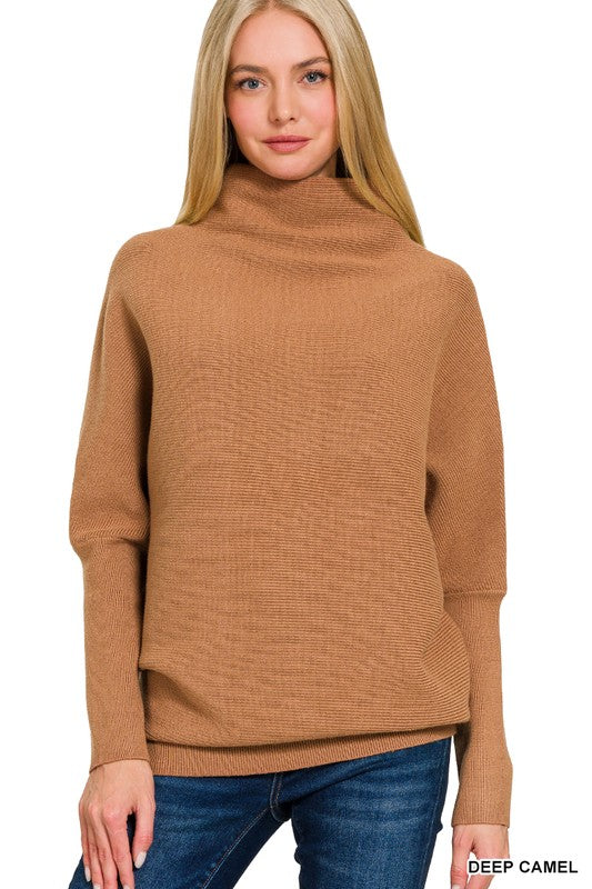 Woman wearing a brown turtleneck sweater on a white background