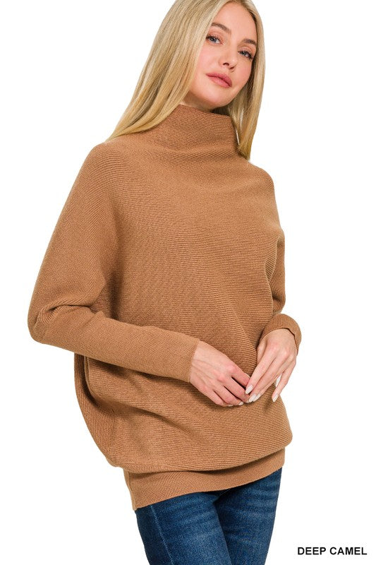 Woman wearing a deep camel sweater on a white background