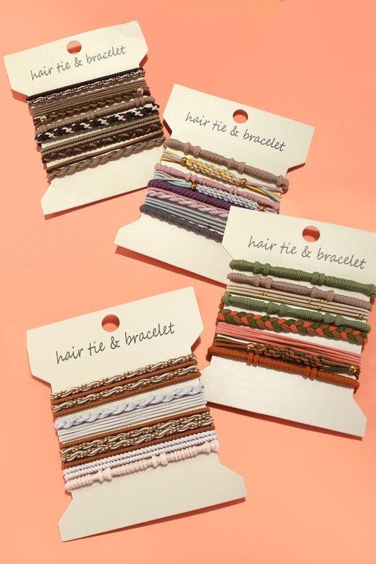 Set of hair tie and bracelet sets on display cards against a pink background