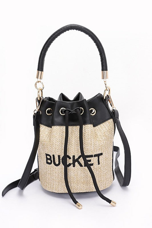 Bucket bag with straw texture and black drawstring on a white background