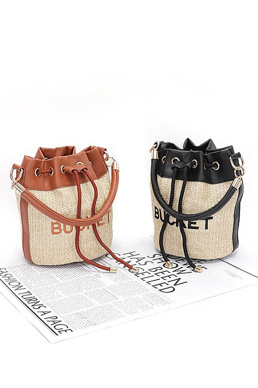 Two bucket bags, one brown and one black, on a white background.