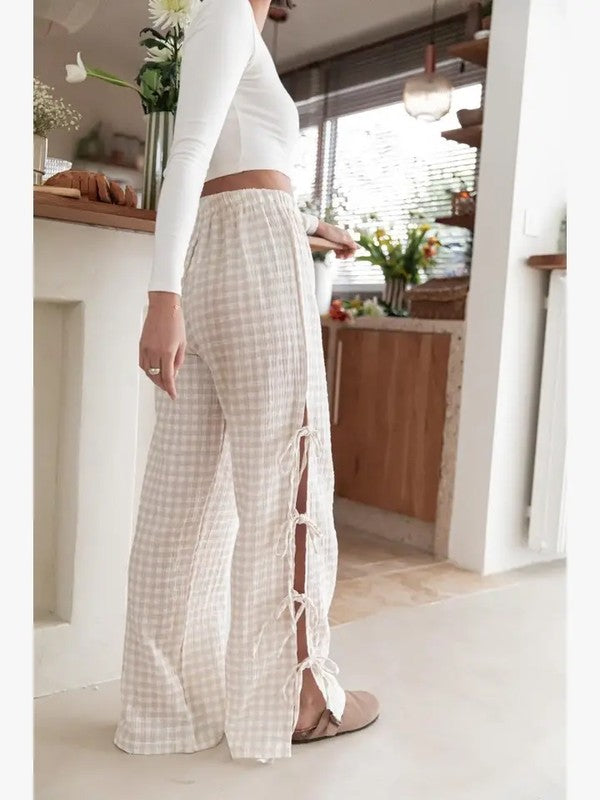 Beige Pants with Bow Ties Down the Side