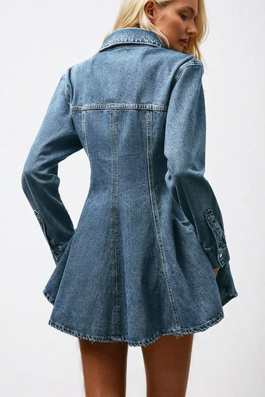 Blue denim dress worn by a person on a white background