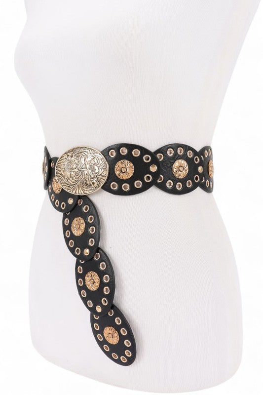 Decorative belt with gold and black design on a mannequin.