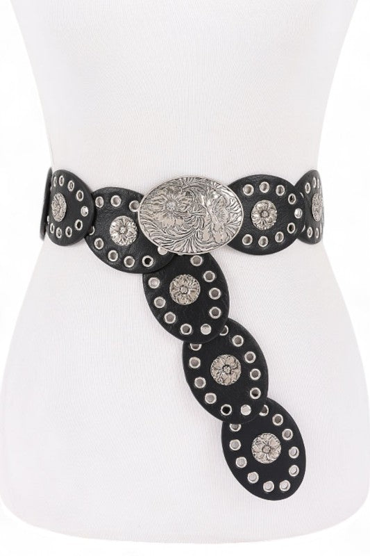 Decorative belt with black strap and silver embellishments on a mannequin.