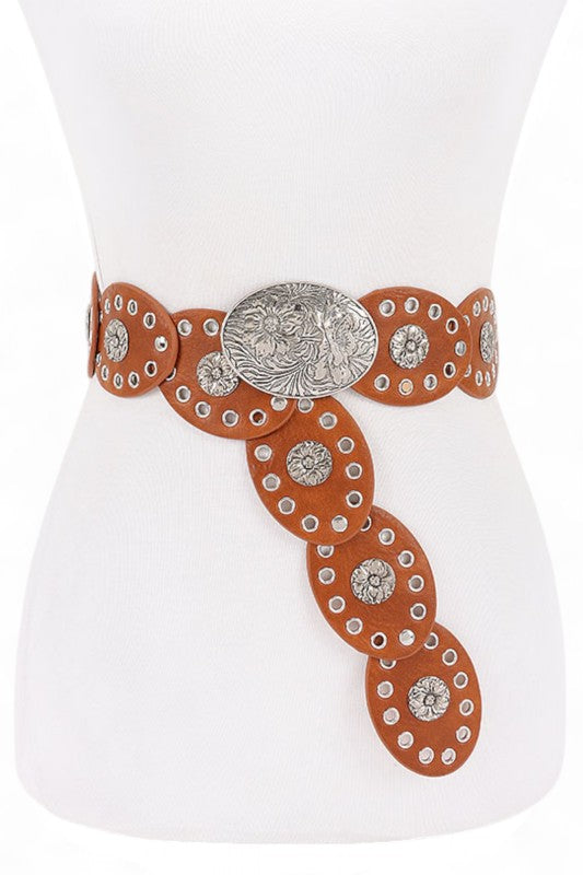 Decorative belt with circular patterns and a central medallion on a white mannequin.