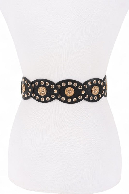 Black belt with gold studs on a mannequin against a white background