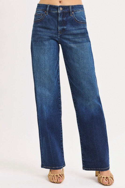 Blue jeans worn by a person on a white background