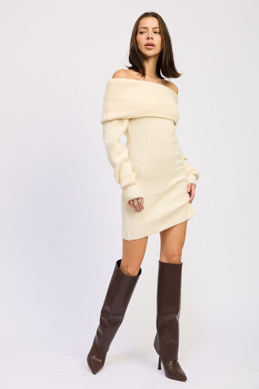 Woman wearing a cream off-shoulder dress with brown knee-high boots on a white background