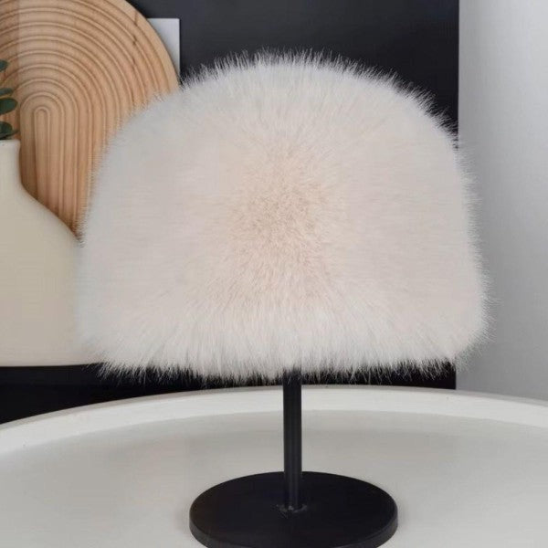 White fluffy lamp on a black stand with a blurred background