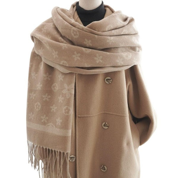 Beige scarf with floral patterns draped over a mannequin on a white background