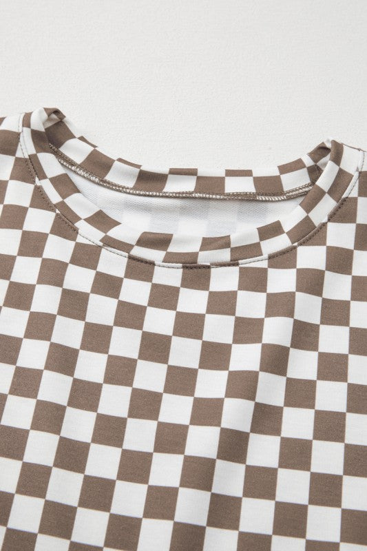 Brown and white checkered fabric with a close-up of the pattern on a light gray background