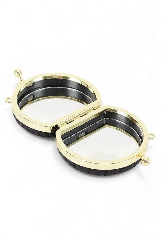 Gold and black circular object on a white background