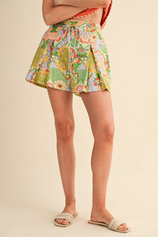Colorful patterned skirt worn by a person on a beige background
