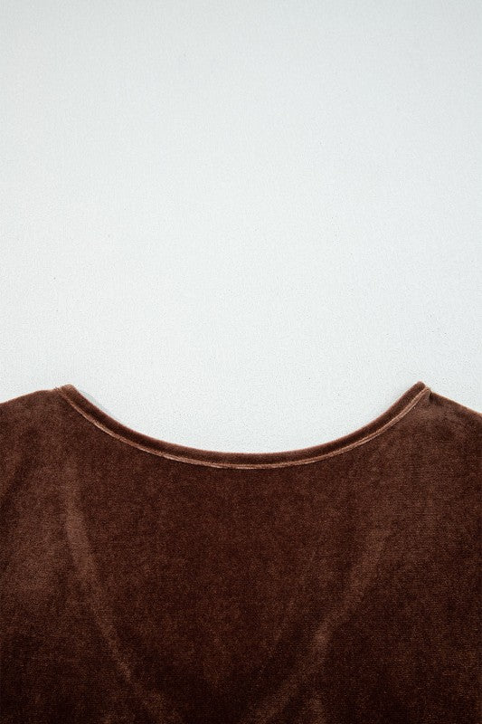 Close-up of a brown garment with a plain white background