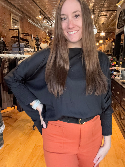 Woman standing in a restaurant with a blurred background