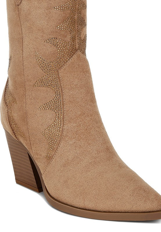Tan ankle boot with decorative pattern on a white background